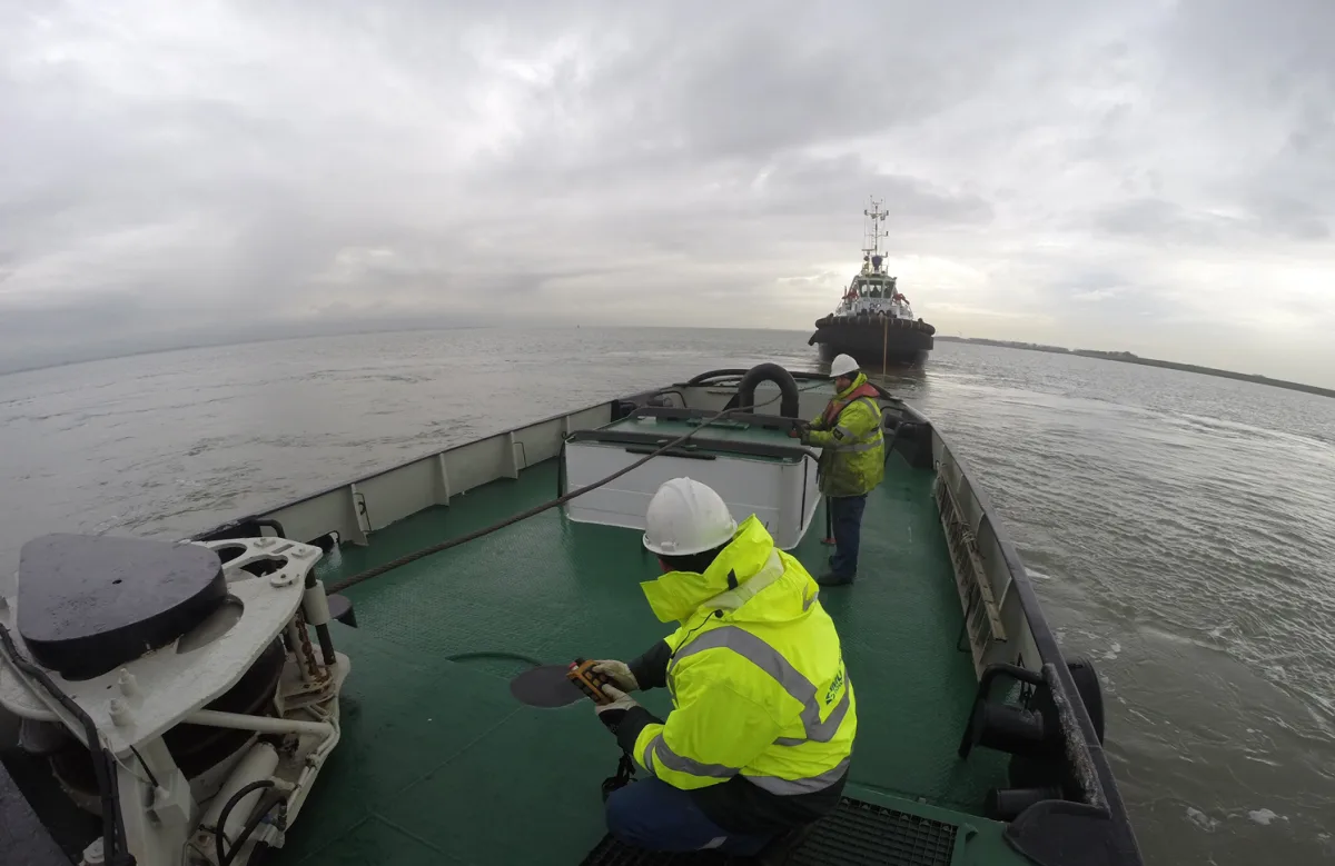 Towing trial with crew working on the deck